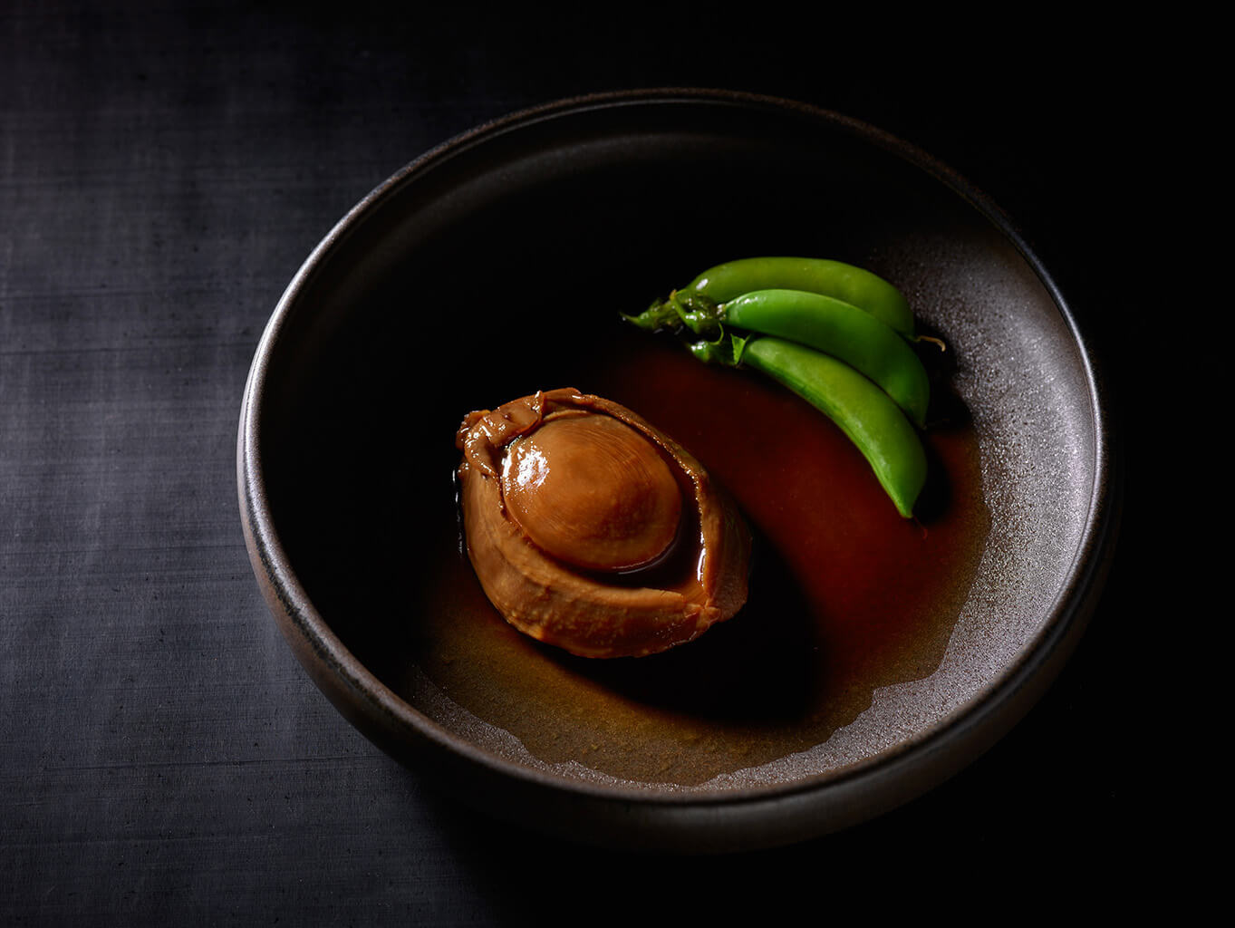 Braised abalone with steamed greens